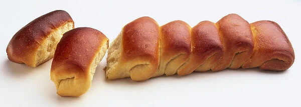 A line of Parker House rolls