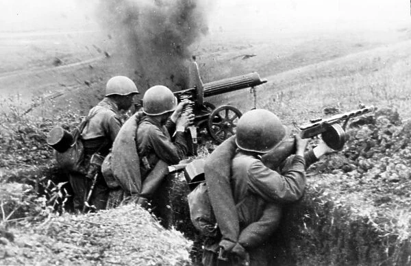 Machine-gunners firing at the germans during battle for a height in the northern caucasus during world war ll, 1942