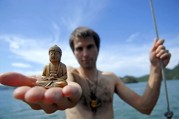 Man with buddha statue