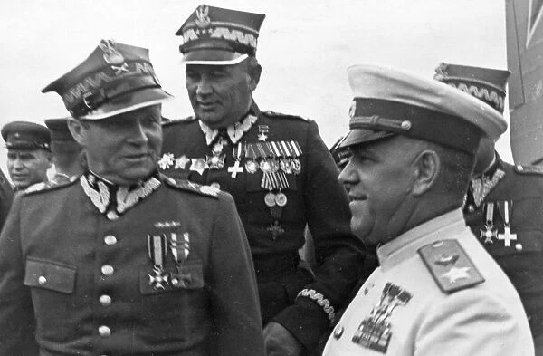 Marshals georgy zhukov and rokossovsky receive highest awards from the polish military, marshal m, rola-zymierski, commander-in-chief of the polish army, zhukov, and colonel-general s, poplawski at the warsaw aerodrome, 1945, world war 2