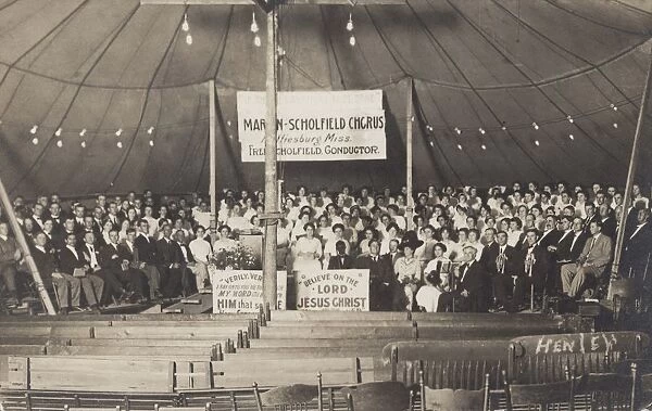 Martin-Scholfield Chorus. ca. 1912, USA, The Martin-Scholfield Chorus of Hattiesburg, Mississippi, sits ready in a large revival tent