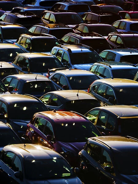 Massed cars in a London car park at sunset 14
