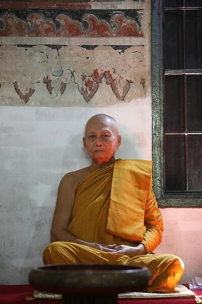 Monk sitting in Buak Khrok Luang temple