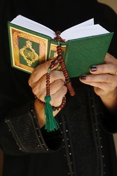 Muslim woman reading the Kuran