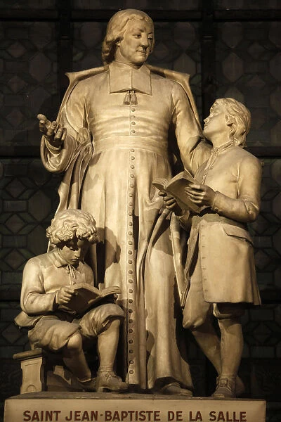 Paris, France Saint-Jean-Baptiste of la Salle sculpture in Saint-Sulpice church