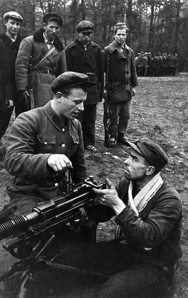Partisans in western byelorussia being taught to fire a heavy machine-gun, world war 2