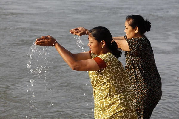 Pilgrims bathing in the Ganges