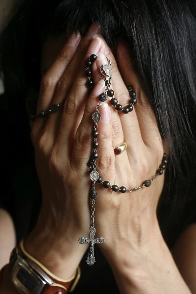 Praying woman Rosary