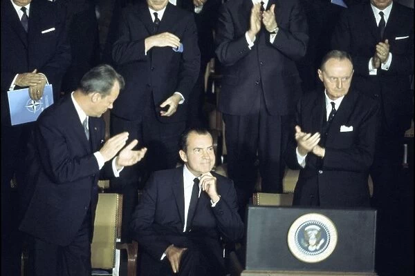 US President Richard Nixon (seated) proposes that NATO should study environmental problems