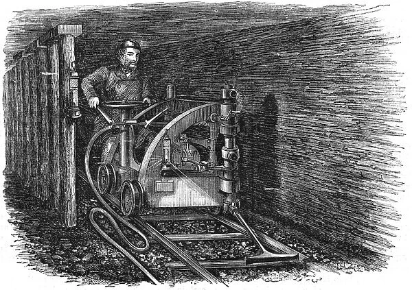 Rail mounted coal cutting machine powered by compressed air produced by a steam engine
