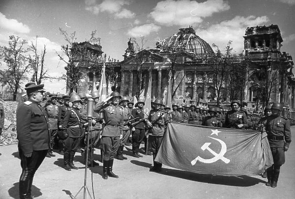 Red army victory ceremony in front of ruined reichstag (chancery) building, berlin, germany, may 1945