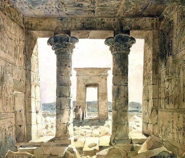 Ruins of the temple complex at Dendera: View looking out between two columns towards gateway