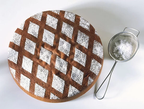 Sieve and cake with criss-cross design