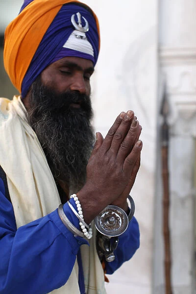 Sikh soldier praying in Bangla Sahib Gurdwara