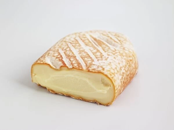 Sliced brick of French Baguette Laonnaise cows milk cheese