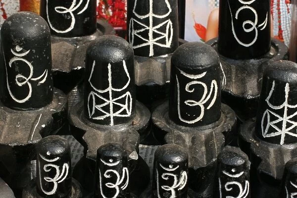 Small lingams sold near a Hindu temple