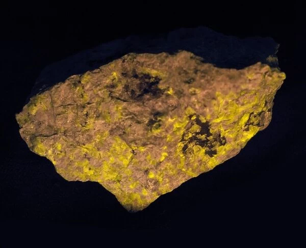 Sodalite glowing yellow in ultraviolet light