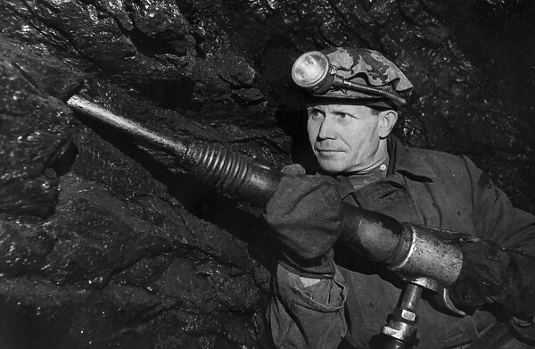 Soviet miner grigory nyrobtsev at work in the lenin coal mine in the molotov region, ussr, 1947