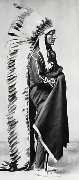Standing Bear, Chief of the Sioux, wearing ceremonial robes and full length head-dress