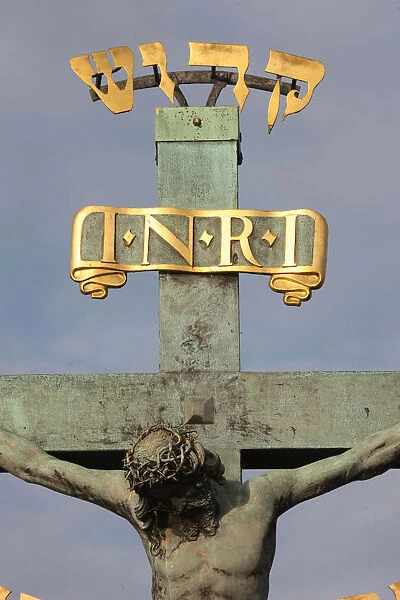 Statue of Jesus on the cross with Hebrew lettering on Charles bridge