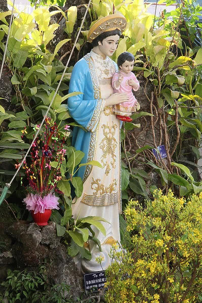 Statue of the Virgin Mary in the garden of a catholic church