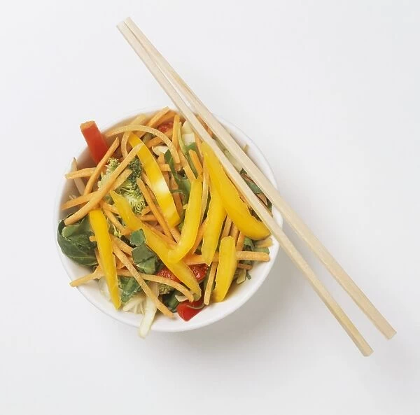 Stir-fry vegetables, chopsticks, overhead view