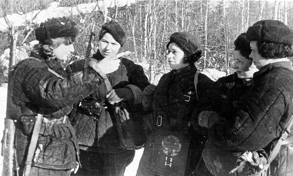 T, shebayeva (l), a guerrilla of the serpukhov district, moscow region, after returning from an assignment, describes to other girls her experiences during world war ll