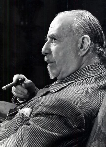 Thomas Beecham (1879-1961) English conductor and impresario. Beecham holding a cigar