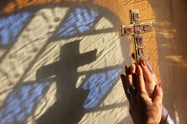Woman holding a cross