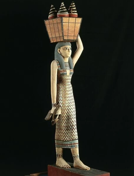 Wood sculpture of female offering bearer from Thebes