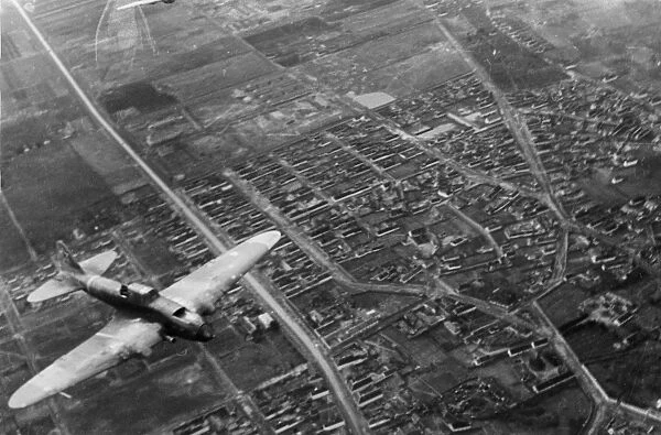 World war 2, 3rd ukrainian front, a soviet shturmovik plane flying over the city during the battle for budapest, january 1945