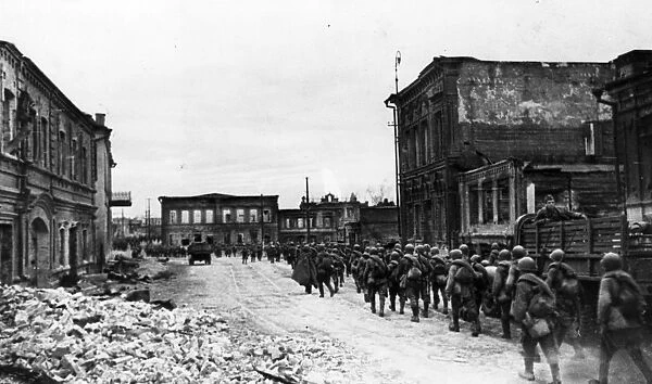 World war 2, battle of stalingrad, reinforcements marching through the streets of stalingrad on their way to the front lines
