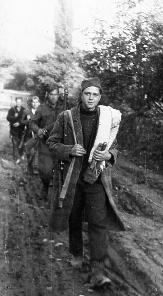 World war 2, december 1944, the yugoslavian national liberation army receives replenishments from the towns and villages liberated from the german fascist invaders, these volunteers, armed with captured enemy arms, on their way to the enlistment station