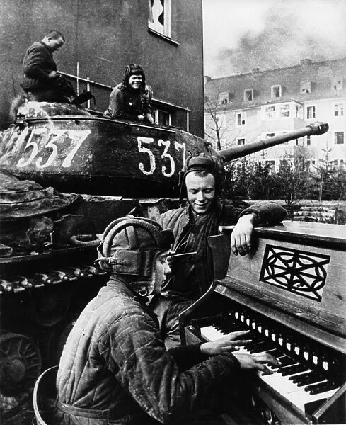 World war 2, a member of a soviet tank crew playing piano at the end of the war (berlinja), 1945