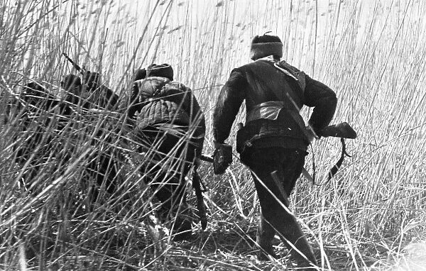 World war 2, russian partisans on their way to an ambush behind enemy lines, july 1942
