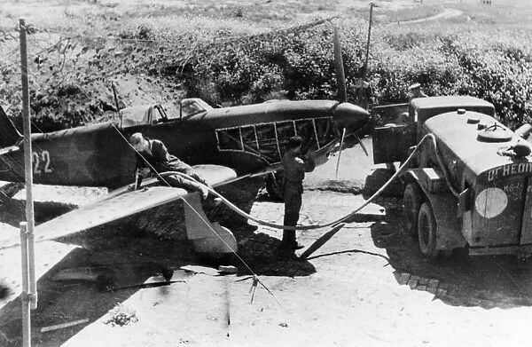 World war 2, soviet air force yakovlev yak-9 fighter being re-fueled in the field
