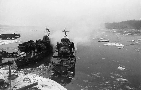 World war 2, soviet armored cutters stalinets and hero of the soviet union golubets of the soviet danube military flotilla moored at the hungarian bank of the danube river, february 1945