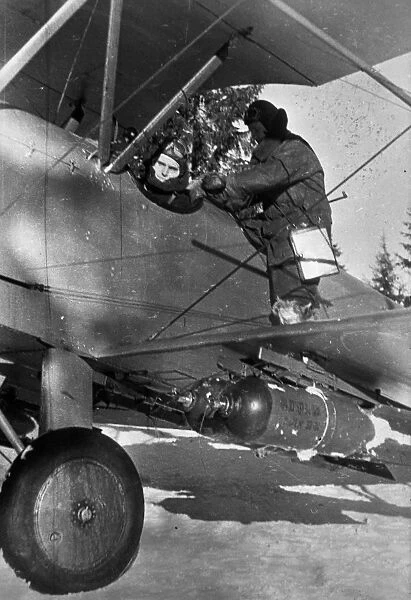 World war 2, soviet pilot preparing for a bombing run in a polikarpov po-2 (u-2) plane, ukraine