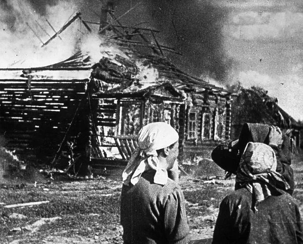 World war 2, soviet women watch as their homes burn with fire set by retreating germans
