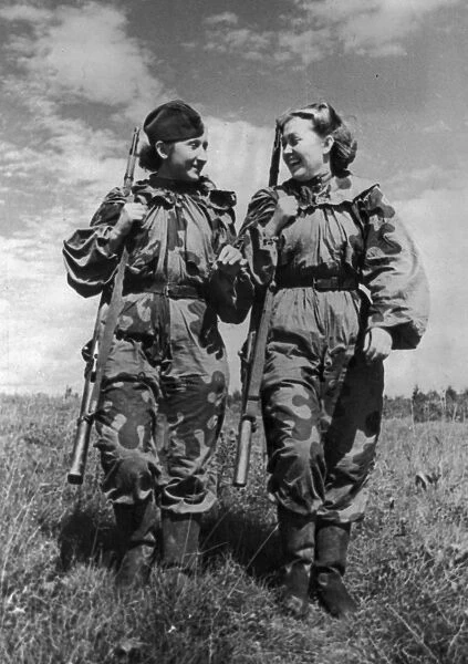 World war 2, volunteer snipers r, skrypnikova (rt) and o, bykova returning from a combat assignment