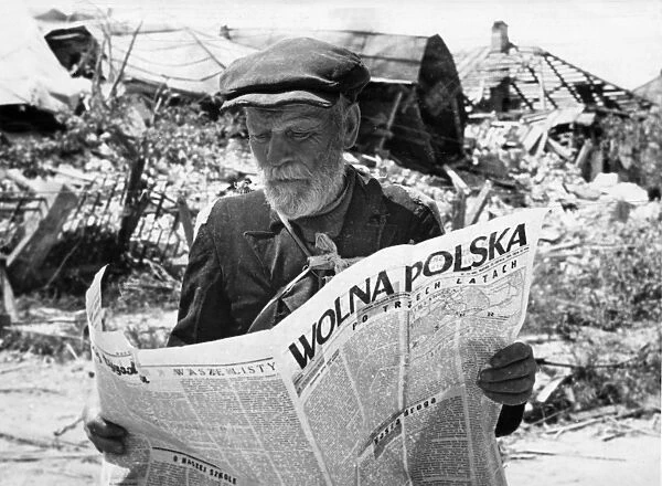 world war ll, a man reading free poland (wolna polska), the newspaper of the union of polish patriots, in warsaw after the liberation of poland in 1944