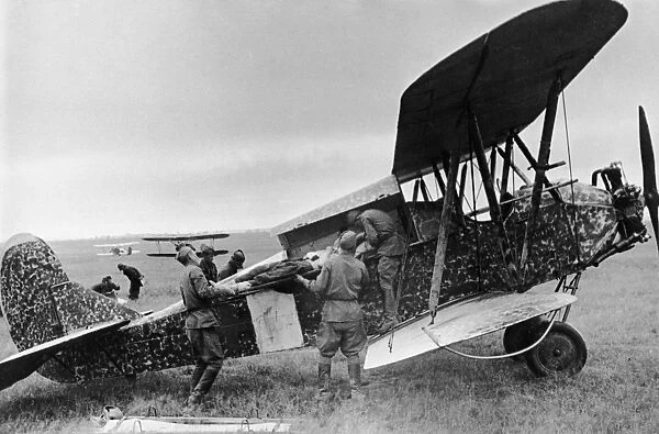 A wounded red army soldier being loaded into a polikarpov po-2 (u-2) plane during world war 2