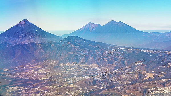 Aerial View of Volcanoes and Part of the Nearby City - Guatemala - Central America