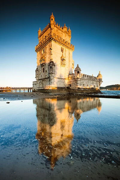 Belem tower reflected into water, Lisbon, Portugal