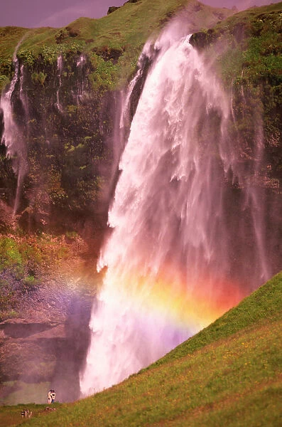 Iceland, Seljalandfoss (waterfall) with rainbow, summer