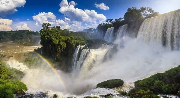 Panorama of the Iguazu waterfalls with rainbow