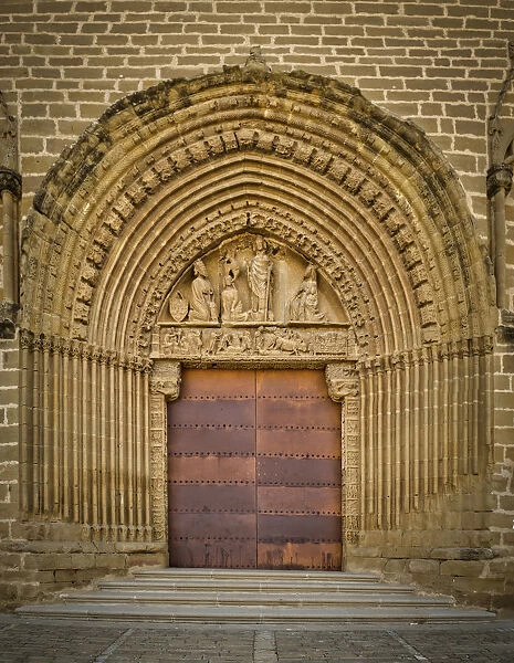 Portico of the church in the center of the city of Artajona in Spain
