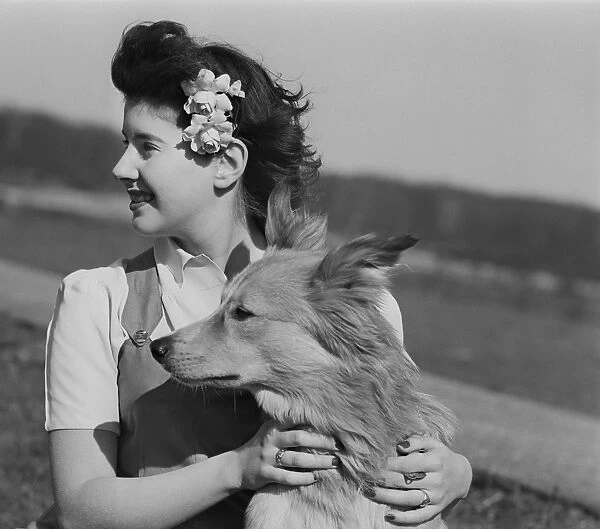 Young woman with dog outdoors