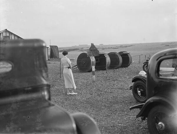 Cars parked on the Dungeness beach in Kent. 1936
