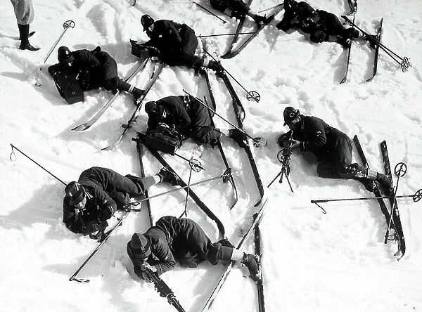 Advance guard soldiers on snow skis in a shooting and marching exercise